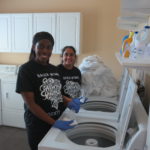 Volunteers doing laundry